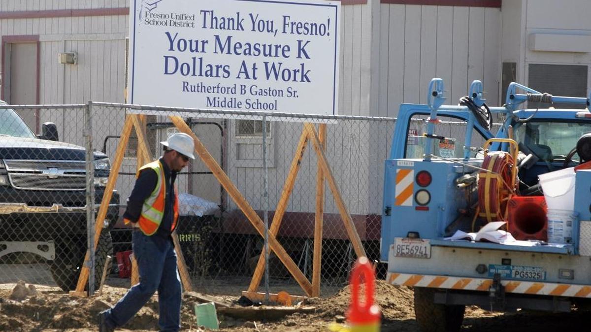 
A sign thanking Fresno for Measure K funds is shown outside the Gaston Middle School construction site in October 2012. Fresno Unified’s use of a $37 million lease-leaseback contract with Harris Construction to build the school is now at the heart of a court case.
