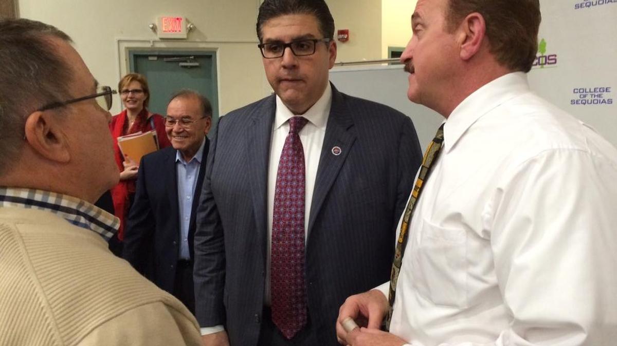 Fresno State Ppresident Joseph Castro, center, chats with Visalia Council Member Bob Link, left, and College of Sequoias President Stan Carrizosa, right.