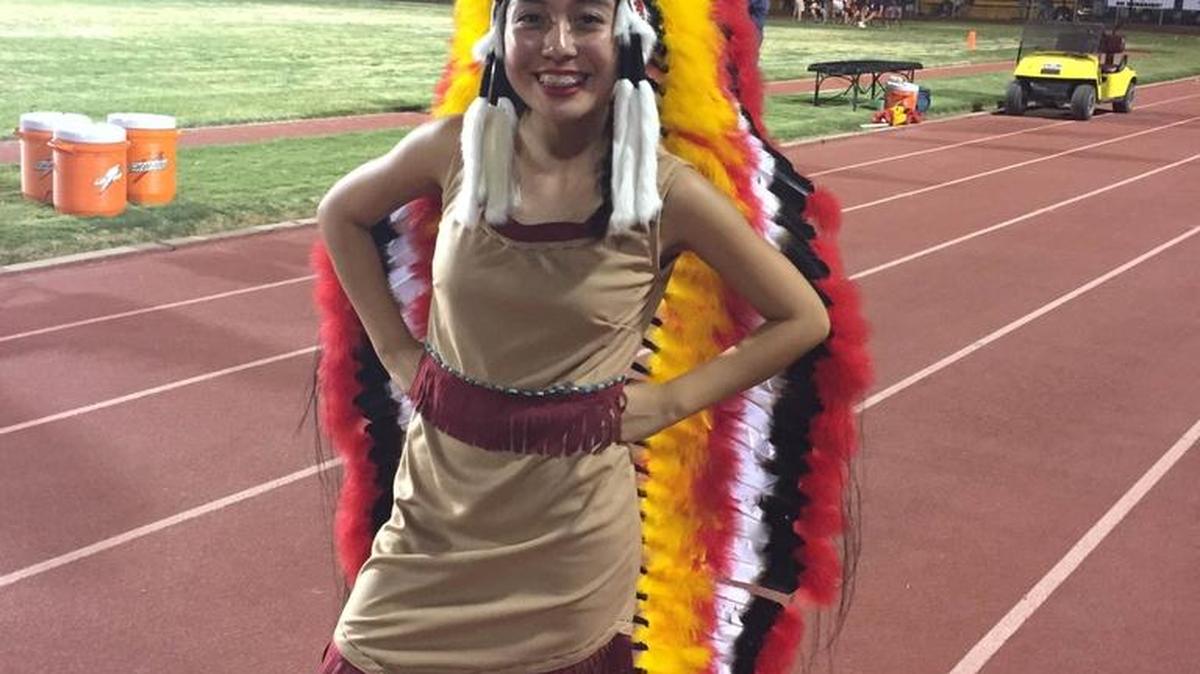 Student Connie Prado, the 2015 Tulare Union Indian princess, wears mascot regalia on game day.