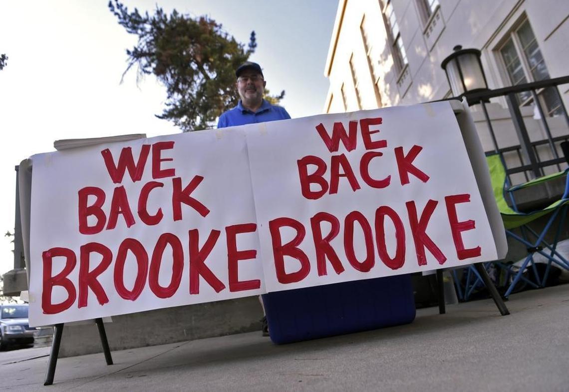 Steve Prout, who was circulating a petition in support of “Judeo-Christian” values, stands at a table supporting Fresno Unified School Board president Brooke Ashjian before the start of Wednesday’s school board meeting. Ashijan has sparked controversy for criticizing LGBT-inclusive sex education, and for likening LGBT advocates to perpetrators of the Armeinan genocide.