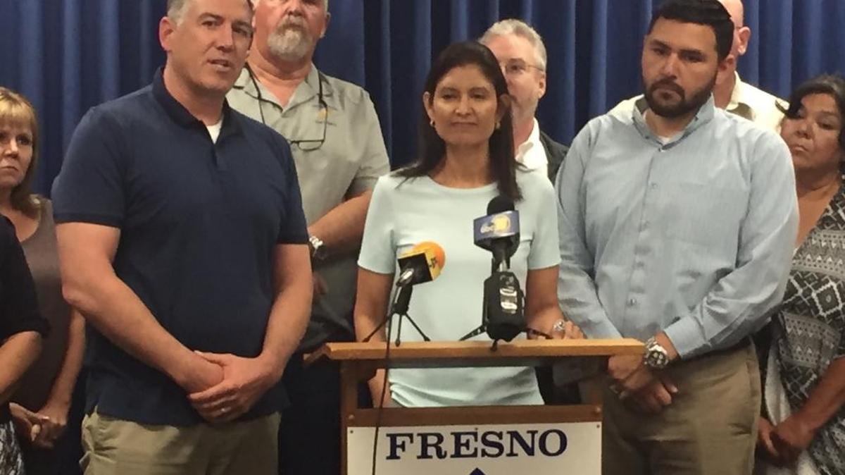 Teachers at Fresno Unified School District talk about failed contract negotiations at a news conference Friday, June 9.