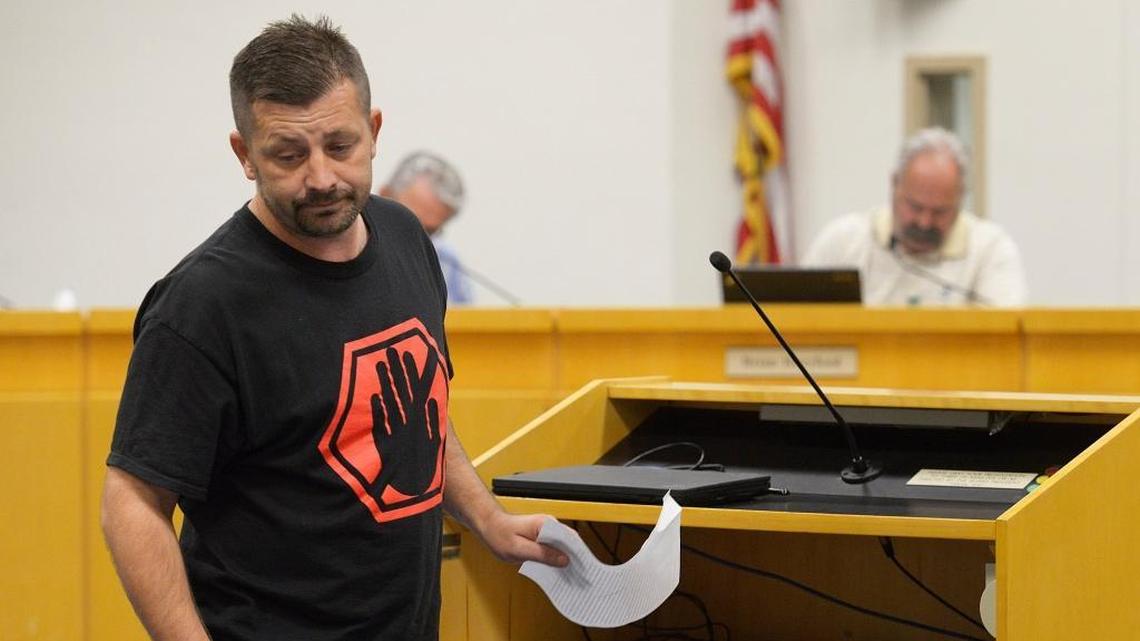 In September 2016, Josh Fulfer addresses the Clovis Unified school board about the transgender bathroom law while wearing a “Stop the Madness” T-shirt.
