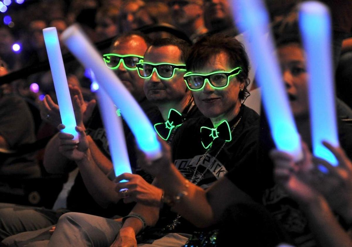 Reagan Education Center administrators get spiffy in their glow-in-the dark glasses and bow ties during the Clovis Unified Back to School Rally at the Save Mart Center Tuesday to celebrate together the start of the 2017-18 school year. From right to left, Suzi Erickson, deputy principal, Joshua Shapiro, deputy principal and Kevin Kerney, principal.