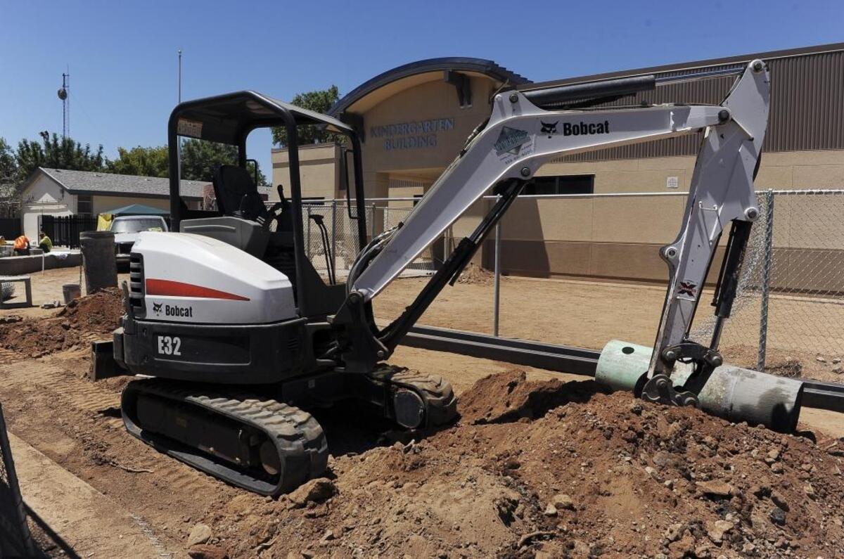 Construction equipment is seen in front of the school following termination of the contract by Fresno Unified School District with Bush Construction at Figarden Elementary School, with the district citing a potential conflict of interest between the contractors and school board president Brooke Ashjian. Photographed Wednesday, June 28, 2017 in Fresno, Calif.