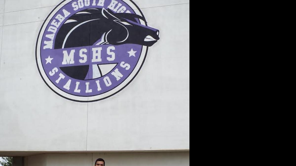 
Jorge Mendoza, center, the founder of a new Students for Life club at Madera South High School, stands with some club members on the campus.
