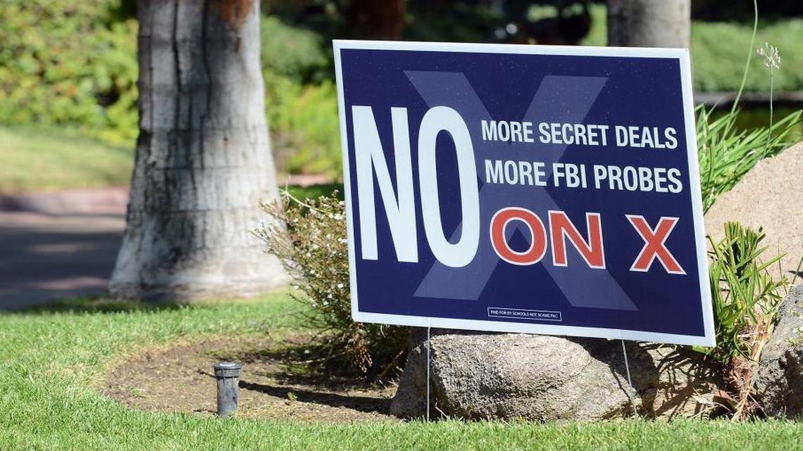 A “No on Measure X” yard sign stands in front of a home on North Forkner Avenue in Fresno. A new political action committee called Schools Not Scams is opposing Fresno Unified’s proposed $225 million school bond measure.