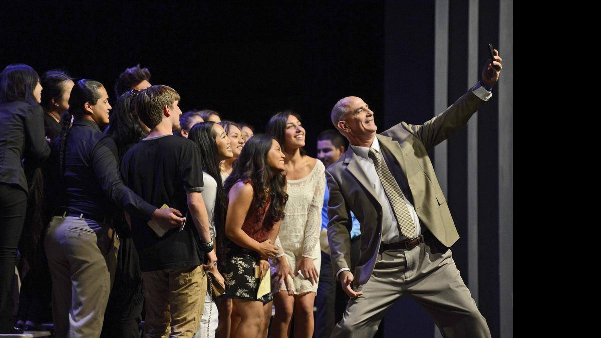 
Sunnyside High School principal Tim Liles, right, takes a group selfie photo with the school’s class of 2015 valedictorians on the stage of the Performing Arts Theatre during the Wildcat Achievement Awards ceremony Wednesday, May 27, 2015. The school will be graduating 47 senior valedictorians at its commencement ceremony at the Save Mart Center on June 8. 
