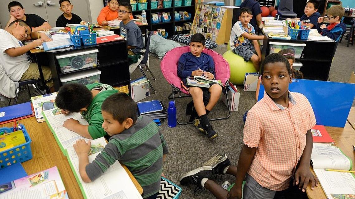 Students work from a variety of seat choices in Brenda McLain’s fourth-grade classroom at McCardle Elementary School in Fresno. After doing some research, McLain decided to introduce flexible seating choices like stability balls, crates and yoga discs to give students the choice for how they would best be able to do their work. She says she saw the changes in behavior and work production right away.