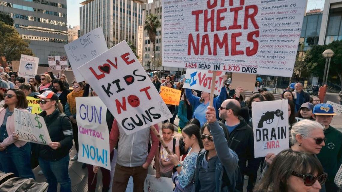 A group of mothers carrying signs join in on a grassroots movement during a rally against gun violence in downtown Los Angeles on Monday, Feb. 19, 2018. Hundreds of sign-carrying, chanting protesters demanded tougher background checks and other gun-safety measures following last week’s deadly school shooting in Florida.