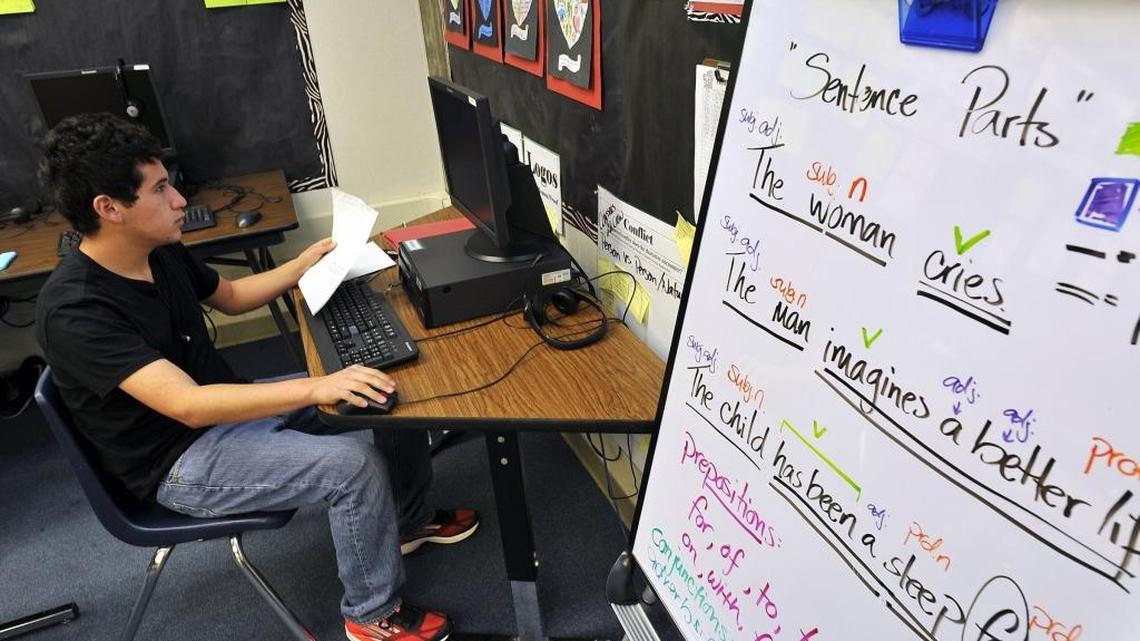 
Student Luis Romero works on an assignment in the English learner class at Buchanan High School.
