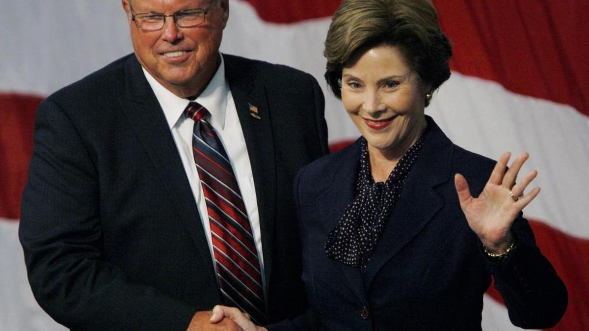 West Hills College Lemoore president Don Warkentin, left, welcomes former First Lady Laura Bush, right, onstage at the Golden Eagle Arena in Lemoore in September 2011.