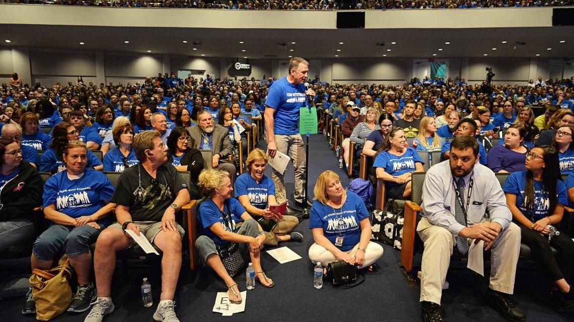 Fresno Teachers Association bargaining chair Jon Bath speaks at the microphone at center, making a motion to go on strike, during a meeting of the FTA in a packed house at Peoples Church in Fresno on Tuesday, Oct. 3, 2017. The membership nearly unanimously voted for the strike.