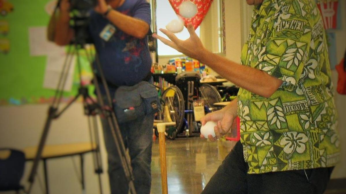 Professional juggler Jeffrey Daymont performs for students at Addicott Elementary School in Fresno.