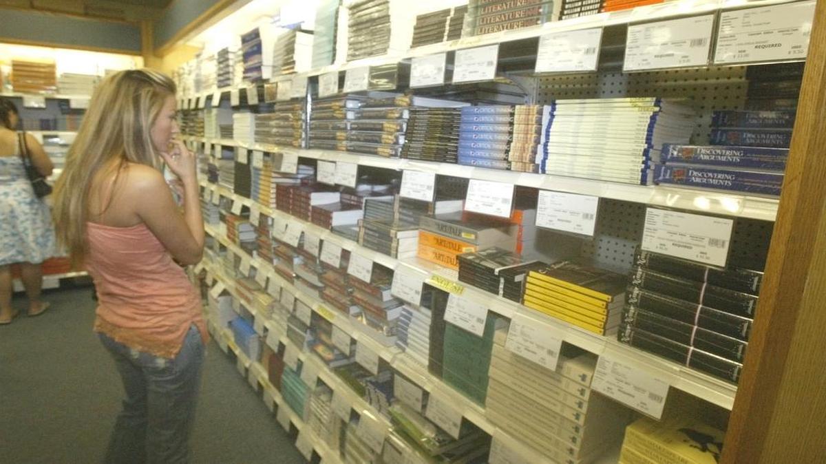 
Nicole Odorico looks for an economics textbook at Clovis Community College. The school has been given full status as a community college.
