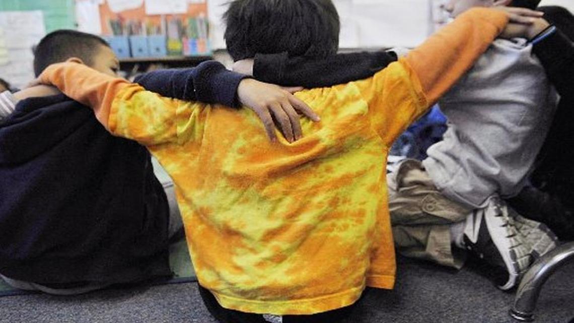 Young students at Alice Birney Elementary School sit in a circle in November, 2015. A new report highlights the challenges Fresno County schools face in teaching students living in poverty.