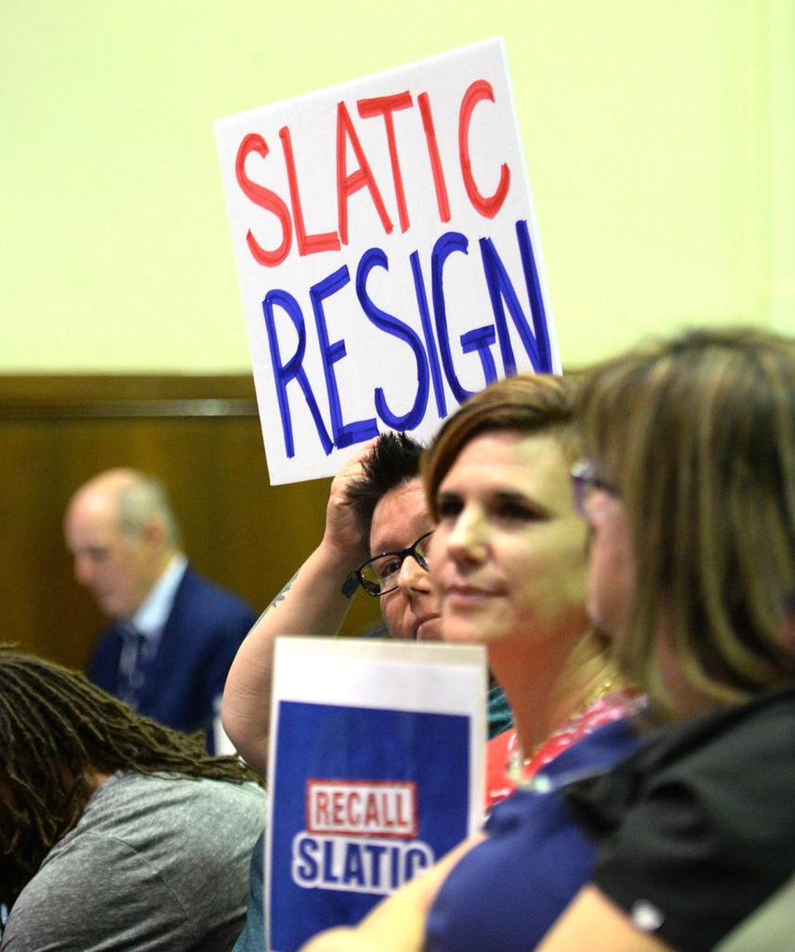 A few members of the public raised signs demanding Trustee Terry Slatic resign. It came during the Fresno Unified School Board discussion of a resolution to censure Slatic on Wednesday, August 7, 2019.