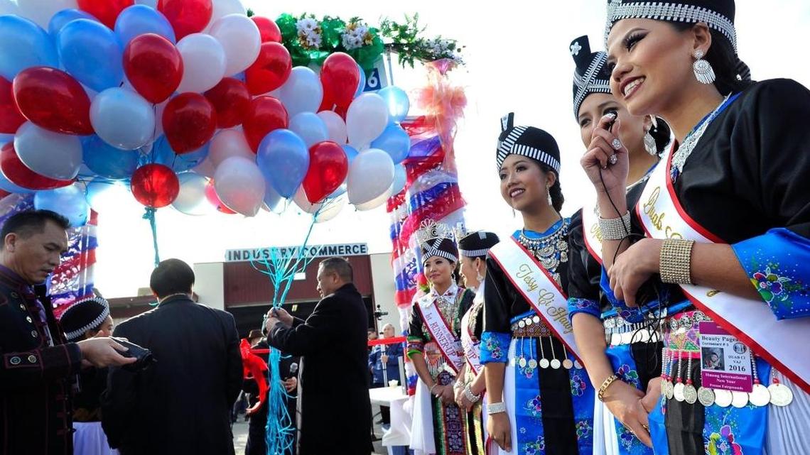 Beauty pageant contestants at the 2015 Hmong International New Year celebration speak for a Hmong television station at the Fresno Fairgrounds.