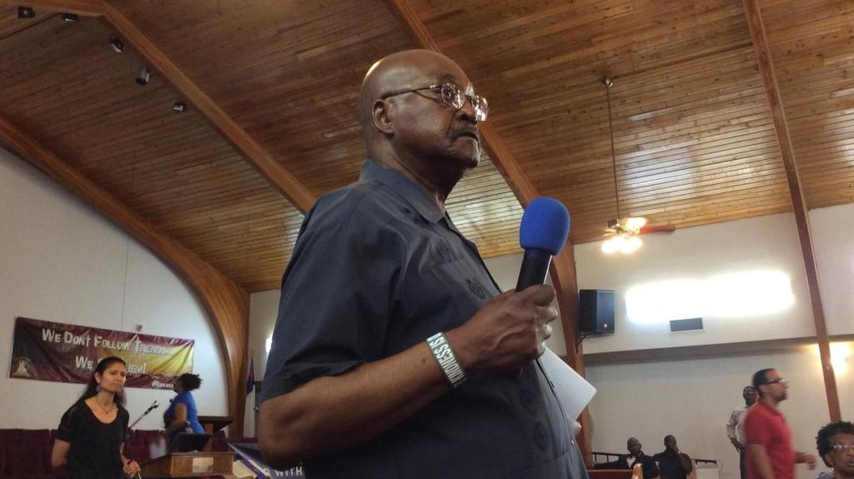 Fresno Unified trustee Cal Johnson listens to a question during a community meeting at Saint Rest Baptist Church in southwest Fresno on Thursday evening.