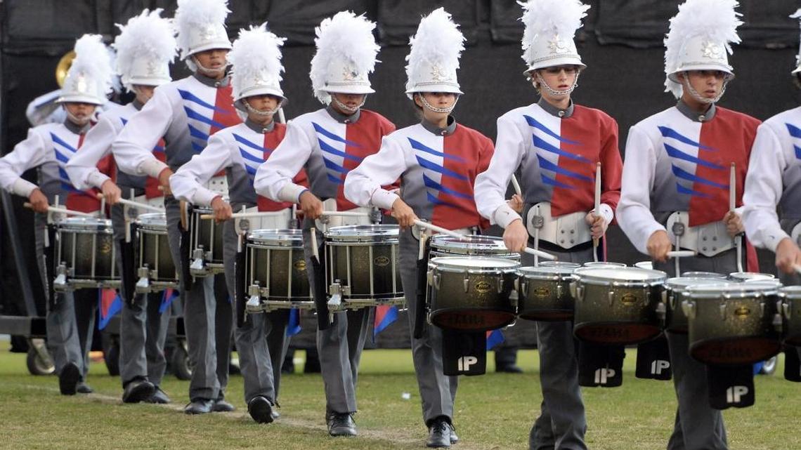 The drum line performs with members of the Buchanan High School Marching Band and Color Guard in a file photo.