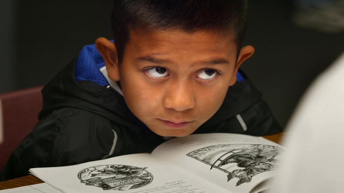 Jackie Garcia, a 4th grader at Jackson Elementary School in Fresno, listens to teacher Nancy Lind as she teaches students strategies for comprehension.