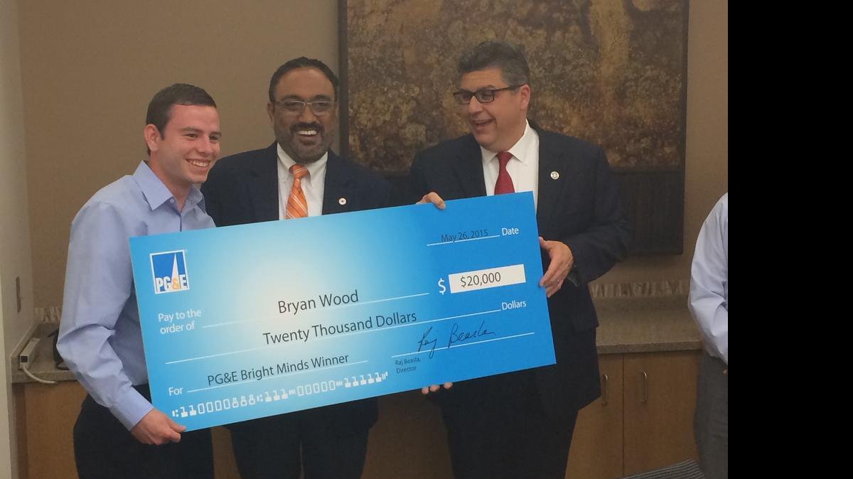 
Fresno State student Bryan Wood, left; Raj Beasla, Central Valley corporate affairs director for PG&E, center; and Fresno State President Joseph Castro celebrate Wood winning a $20,000 scholarship from the utility company.
