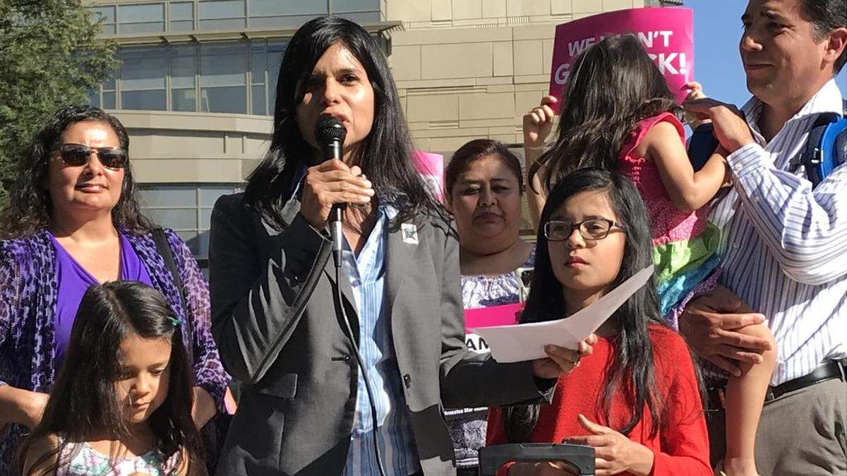 Aileen Rizo celebrates outside the federal courthouse in Fresno after winning a court case that rules employers cannot justify paying women less than men for the same work based on salary history. The Supreme Court on Monday vacated that ruling because one of the judges whose vote helped swing the case in her favor died before the decision was handed down.