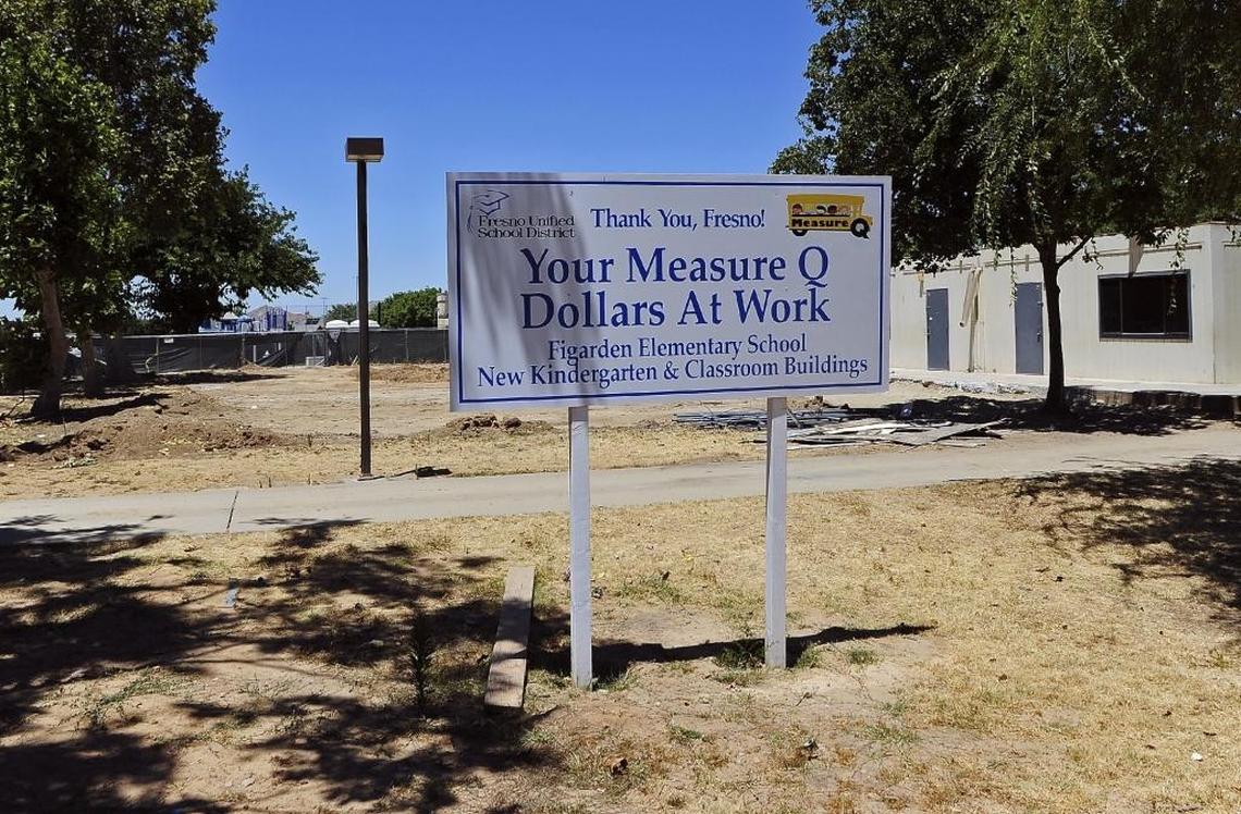 A Measure Q sign is shown at Figarden Elementary following termination of the contract by Fresno Unified School District with Bush Construction at Figarden Elementary School, with FUSD citing with the district citing a potential conflict of interest between the contractors and school board president Brooke Ashjian. Photographed Wednesday, June 28, 2017 in Fresno, Calif.