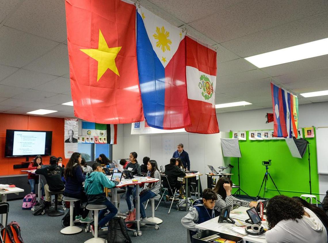 Country flags hang in Efraín Tovar’s newcomers class at Abraham Lincoln Middle School in Selma on Friday, Jan. 11, 2019.