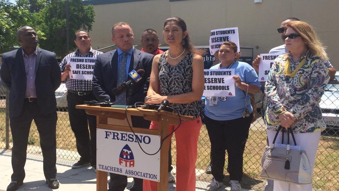 Fresno Teachers Association President Tish Rice, alongside Fresno Unified trustees Brooke Ashjian, left, and Carol Mills, right, held a news conference outside Bullard High on Wednesday, calling for stricter discipline policies.