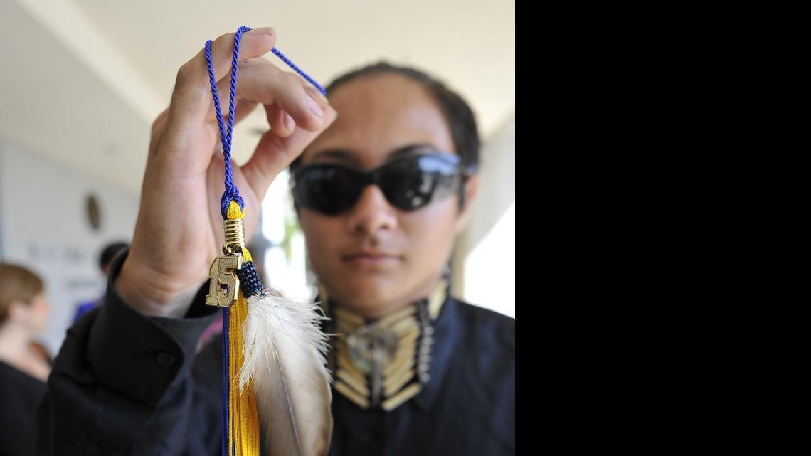
Clovis High senior Christian Titman holds his graduation tassel with a hawk feather, after a hearing at the B.F. Sisk Courthouse. He wants to wear an eagle feather during graduation ceremonies. 
