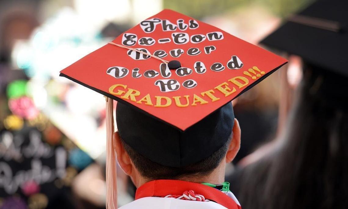 Arnold Trevino, one of four graduates in Fresno State’s Project Rebound, has his graduation cap decorated with the words “This ex-con never violated, He graduated!” during the Department of Social Work graduation ceremony at Woodward Park’s Rotary Amphitheater on Friday, May 19, 2017.
