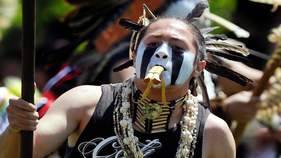 
In an April 2015 file photo, Christian Titman dances in the grand entry of the Fresno State First Nations Powwow held at O'Neill Park. Titman and his family say Clovis High is prohibiting him from wearing an eagle feather with his cap and gown for the school’s graduation ceremony.
