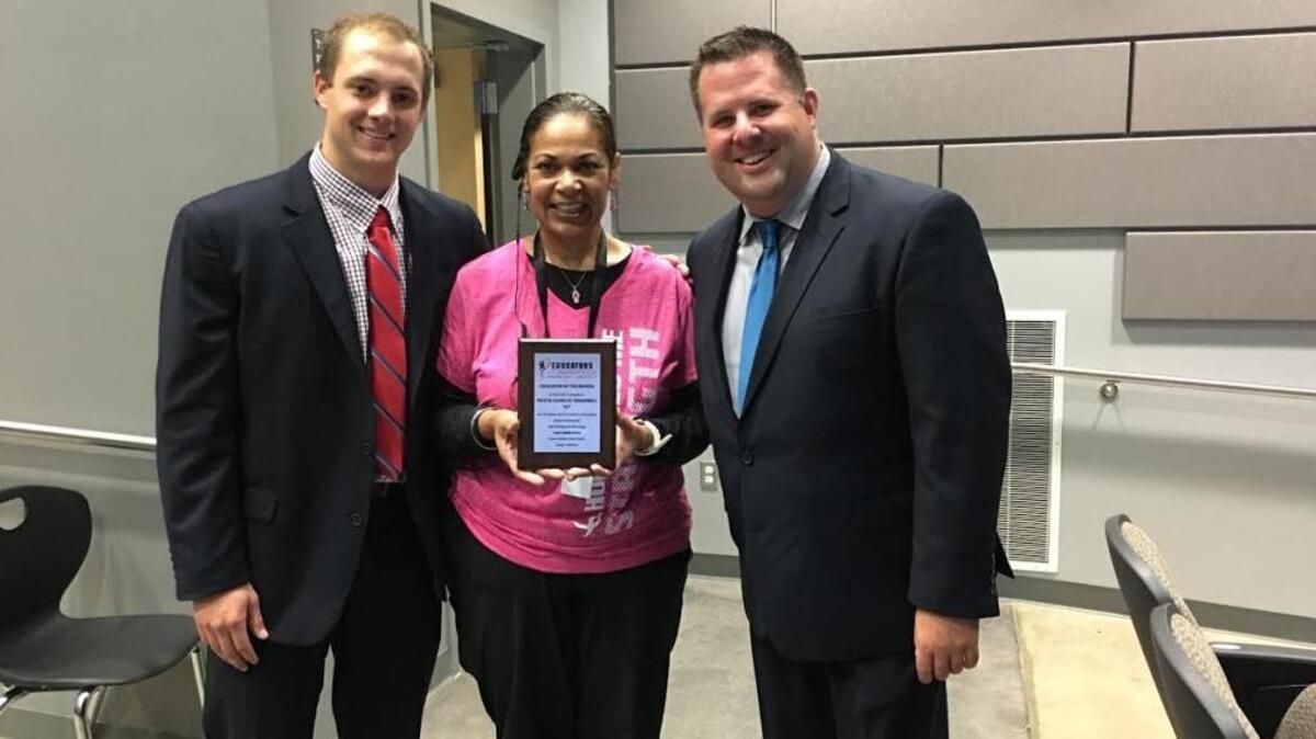 
Felicia Quarles Treadwell, center, receives the Educators of America monthly award for October.

