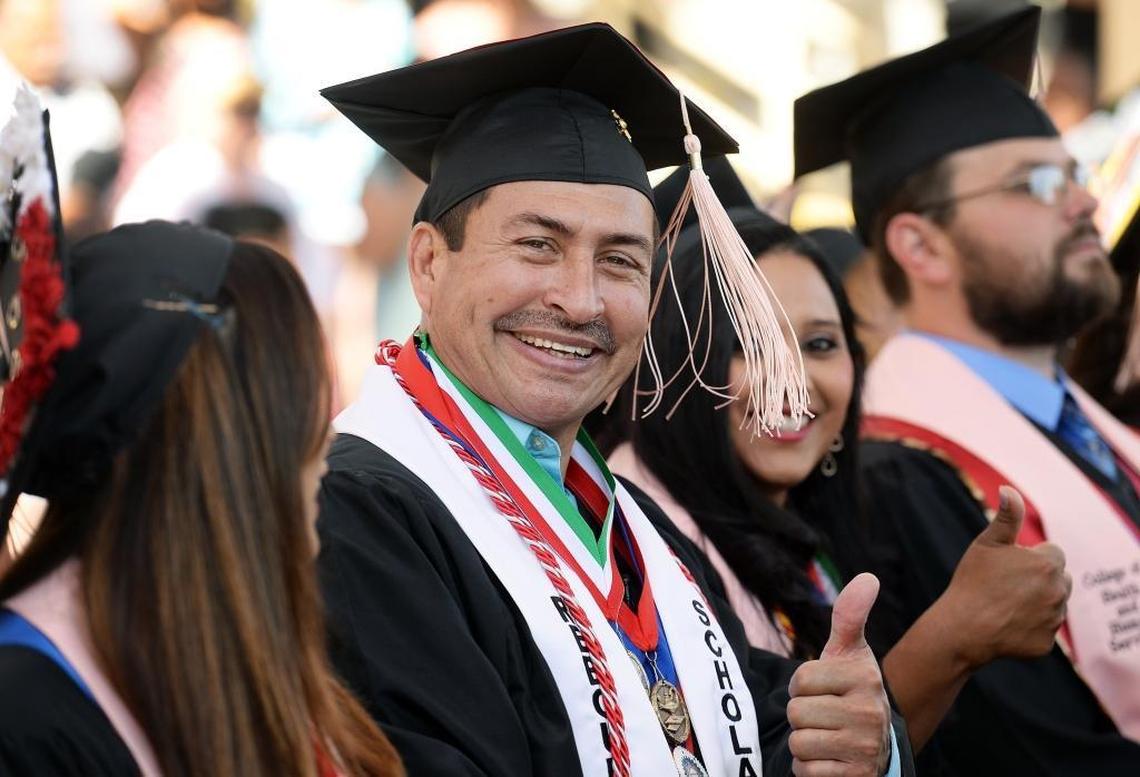 Arnold Trevino, one of four graduates in Fresno State’s Project Rebound, signals with a thumbs up among his fellow graduates in the Department of Social Work graduation ceremony at Woodward Park’s Rotary Amphitheater on Friday, May 19, 2017.
