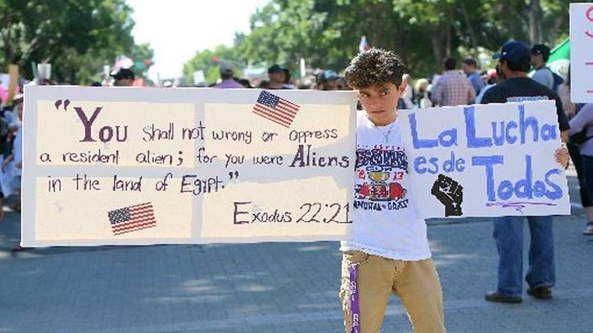 San Joaquín Memorial High student Daniel Prieto protests at a Donald Trump rally at Fresno’s Selland Arena in May.