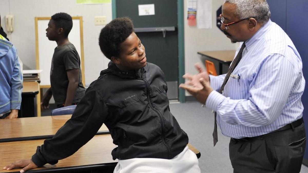 Kalani Richard, 11, listens to mentor Gregory Barfield during a mentoring session at Kirk Elementary School in 2015. Barfield joined Fresno Unified’s Boys to Men program to focus on black student issues.