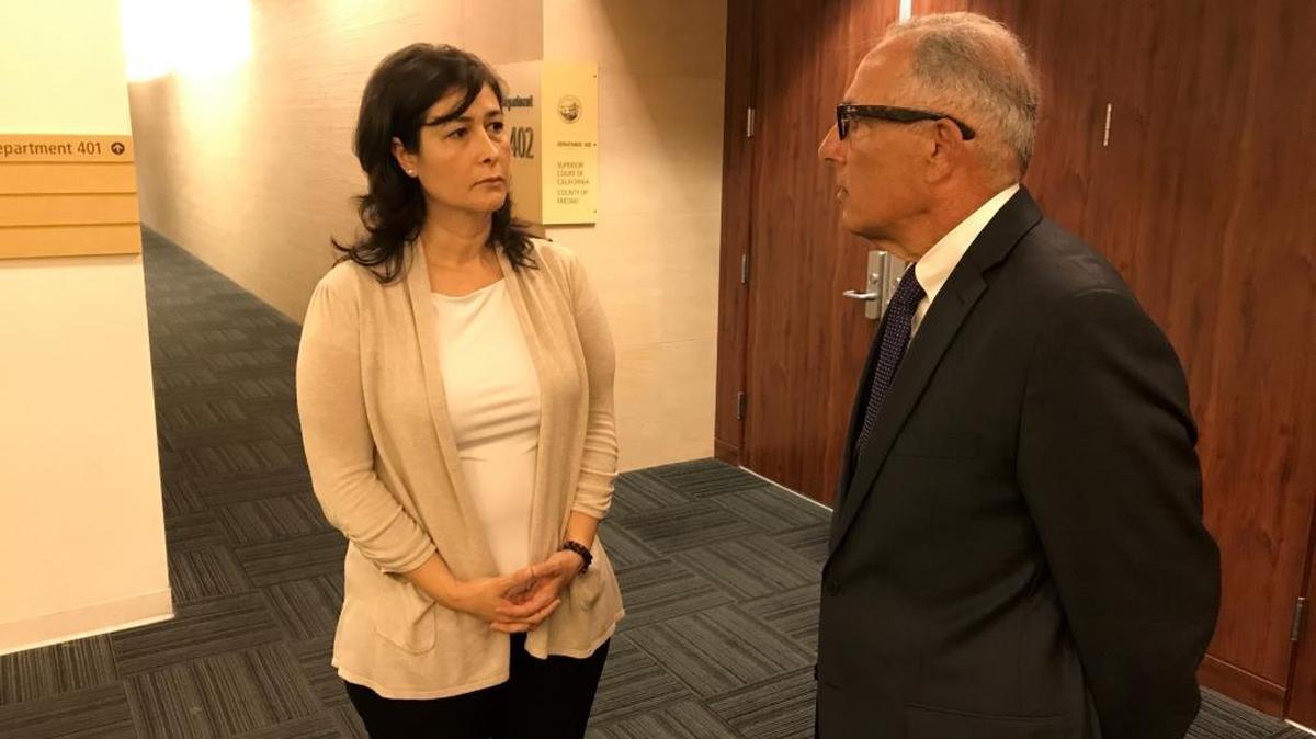 Ani Sanikian, 46, of Fresno, talks with her attorney Mick Marderosian during a break Thursday, Aug. 17, 2017, in her civil trial at Fresno County Superior Court in which she has accused Kaiser Permanente Fresno of wrongful termination, retaliation, and defamation.
