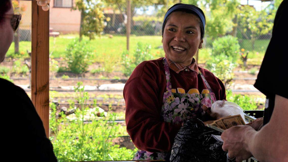 Liset Garcia, the Latina farmer who created Sweet Girl Farms, joyfully attended customers at her roadside farmstand in Reedley, a rural city in Fresno County, on April 17, 2023.