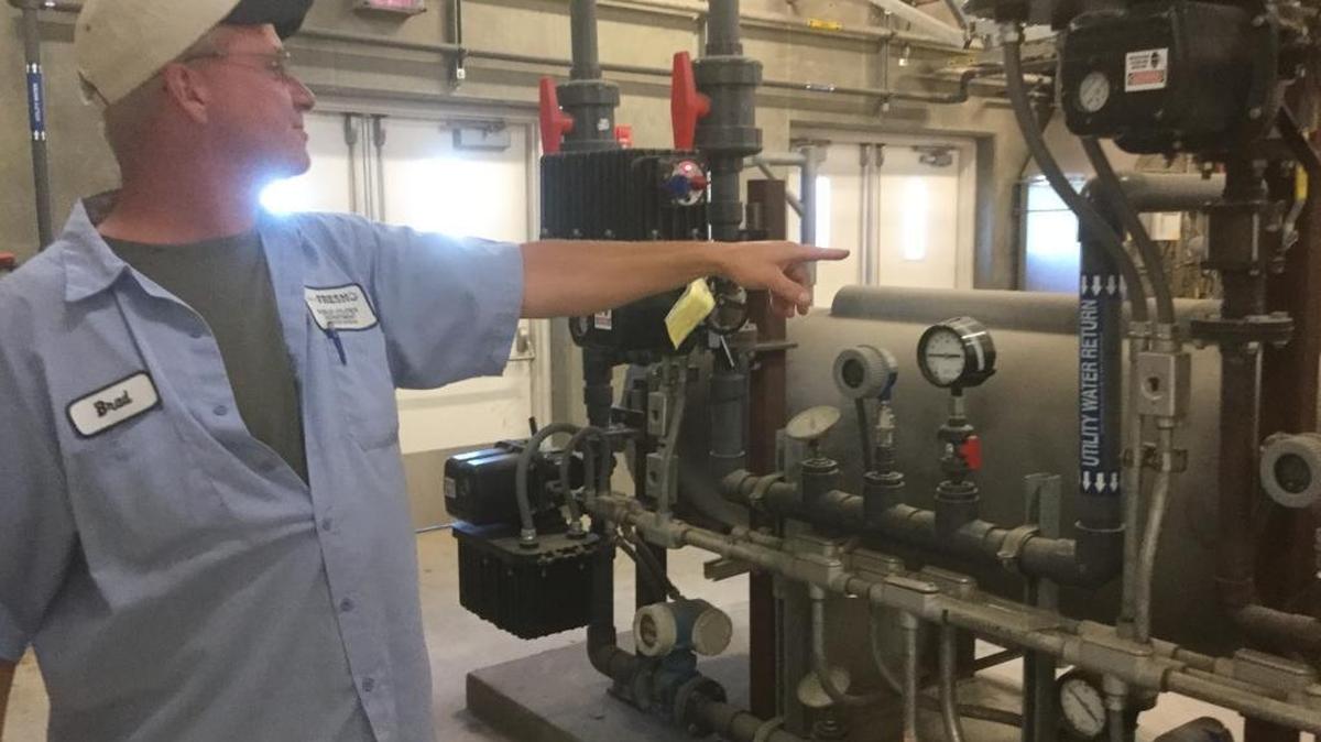 Brad Hoagland, a plant operator at Fresno’s Northeast Surface Water Treatment Plant, explains how an ozone generator disinfects surface water from the Enterprise Canal so it can be distributed through the city’s drinking water system. This plant and another under construction in southeast Fresno are keys to the city’s plan to reduce its reliance on pumped groundwater.