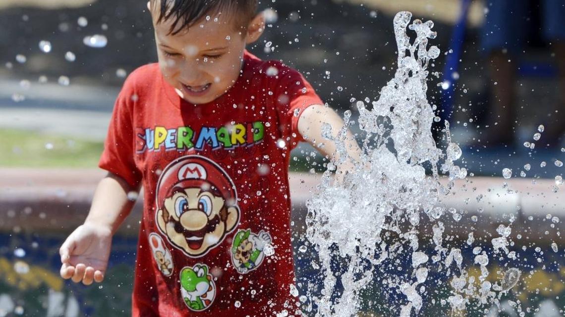 Devin Mejines, 6, splashes at the Dickey Park waterpark under sunny skies in 2014.