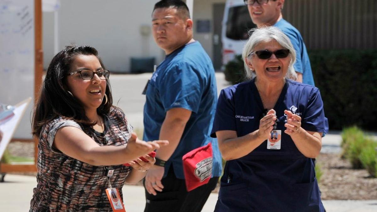 The central San Joaquin Valley enjoyed one last day of temperatures in the 80s Wednesday before a hot spell hits: Thursday’s forecast high in Fresno is 96 in Fresno, followed by 93 Friday. Paola Leyva left, tosses a bean bag as her team partner Sandra Barbo, right, cheers her on in one of the many activities held at Community Regional Medical Center in downtown Fresno on Wednesday as part of Hospital Week.