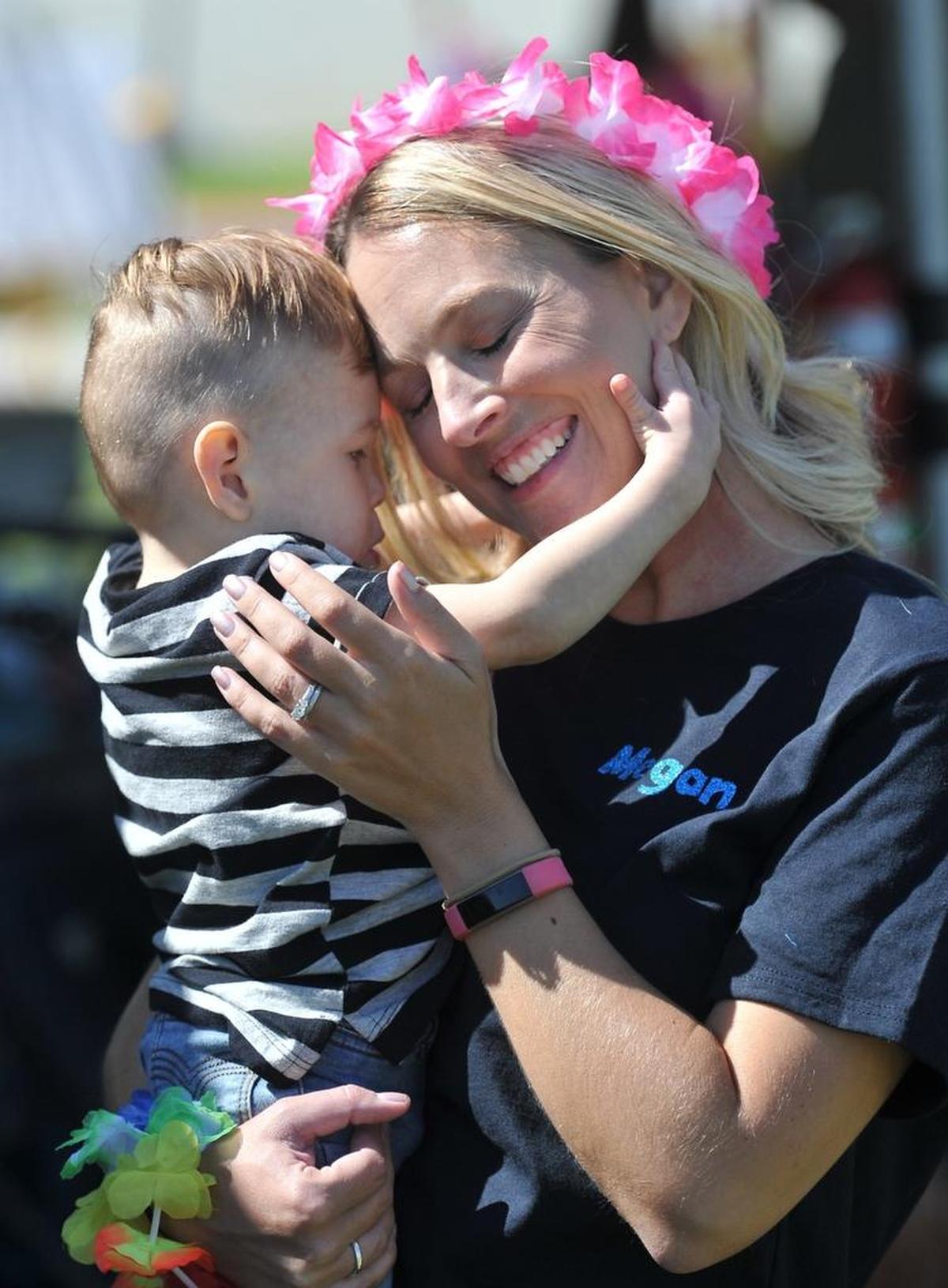 Megan Green, a Clovis Community Medical Center RN in the NICU, reunites with former patient, Corbin Tucker, now 1 1/2 -years-old, during a reunion party at Clovis Community Medical Center Saturday afternoon, Sept. 23, 2017. She cared early on for Corbin, who was born with a chromosome disorder.