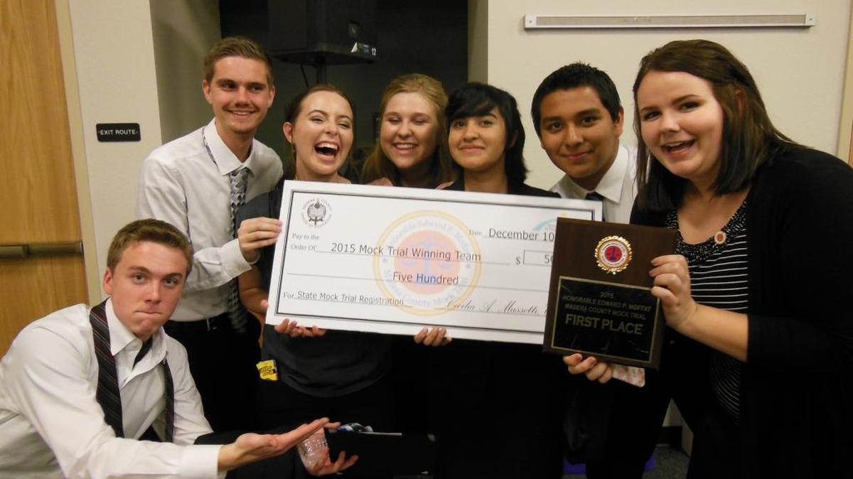 Liberty High students show off their first-place trophy and $500 check for winning the 2015-2016 Honorable Edward P. Moffat Madera County Mock Trial last week against Madera, Madera South, Yosemite and Dos Palos high schools.