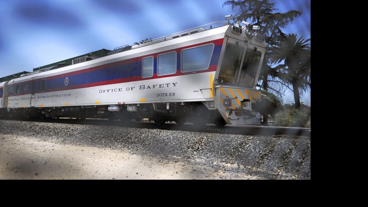 
The Federal Railroad Administration’s FRA DOTX 219 Track Geometry Car is seen idling on the Union Pacific Railroad main line along Roeding Park near downtown Fresno Tuesday morning, June 30, 2015. The self-propelled 106-ton vehicle is one of five traveling on railroad main lines across the U.S. for the FRA’s Automated Track Inspection Program. It contains an array of instruments and sensors to measure the alignment of the steel rails, track quality, wear and tear and other safety factors. It also has a kitchen, a computer room and seating for 19 people in addition to the engineer. DOTX 219, entered FRA service in 2007 and annually surveys about 30,000 miles of railroad track.

