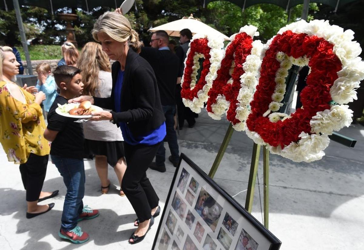 People attend the public reception at Holland Park West for Mark Gassett on Tuesday afternoon, April 25, 2017. He was killed in last week’s rampage shooting.