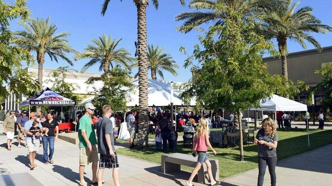 Customers are shown walking at the Campus Pointe center near Fresno State.