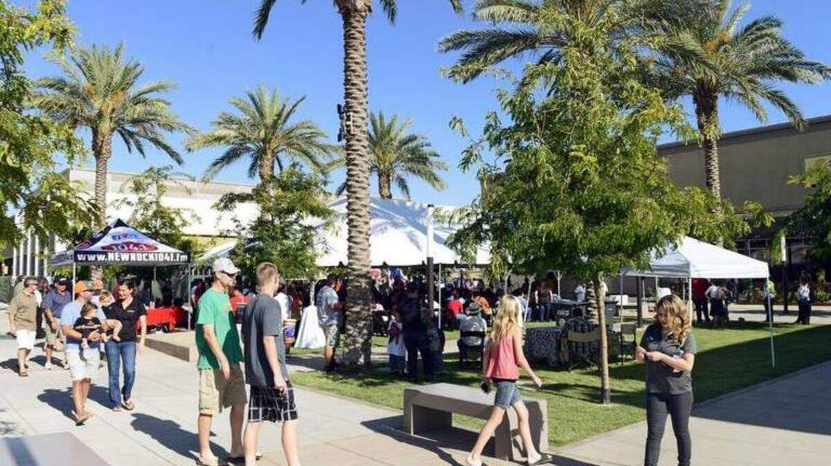 Customers are shown walking at the Campus Pointe center near Fresno State.