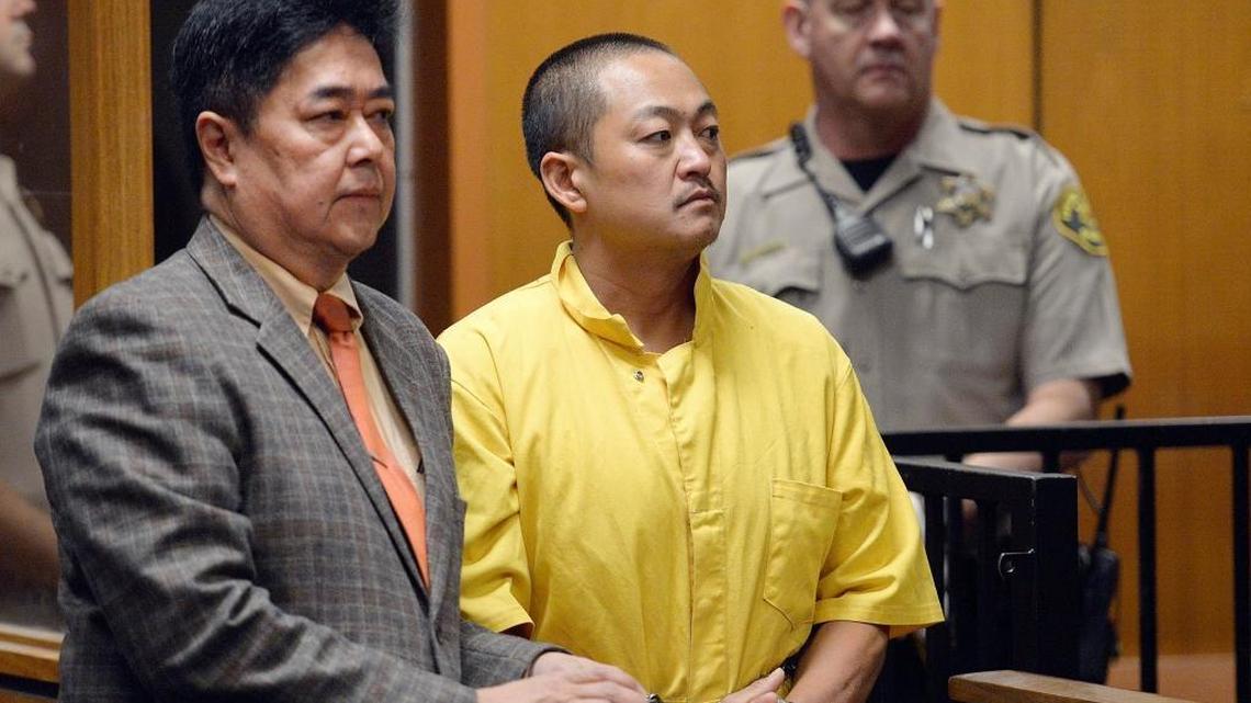 Thong Vang, center, 37, appears with his attorney Roberto Dulce in Fresno County Superior Court on Thursday, Sept. 8, 2016.