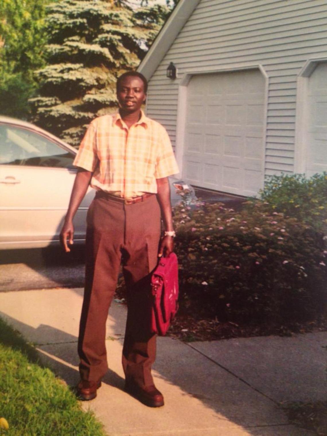 Jacob Awar Ayuen, one of the “Lost Boys of Sudan,” outside his first apartment in Vermont in 2001.