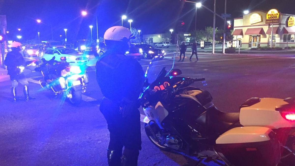 Fresno police officers work to keep the traffic moving on Blackstone Avenue at Ashlan Avenue on Easter Sunday night, March 27, 2016.